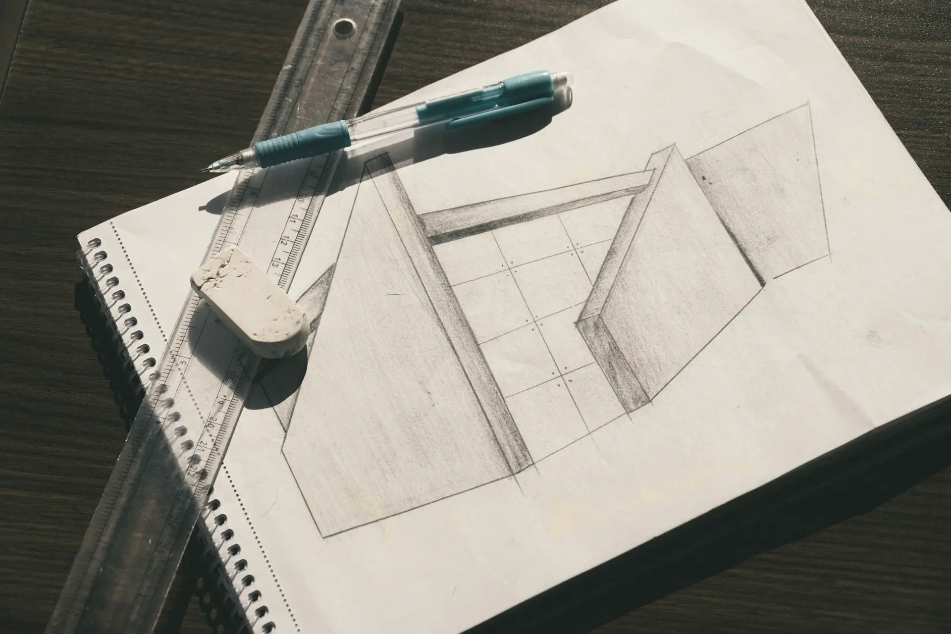 Pencil sketch of a system layout with a ruler and eraser